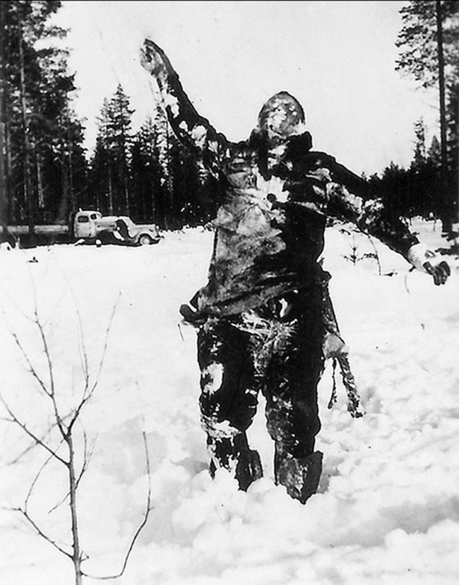 11.) A frozen Soviet fighter propped up by Finnish soldiers to wreak psychological warfare on the invading Soviets.